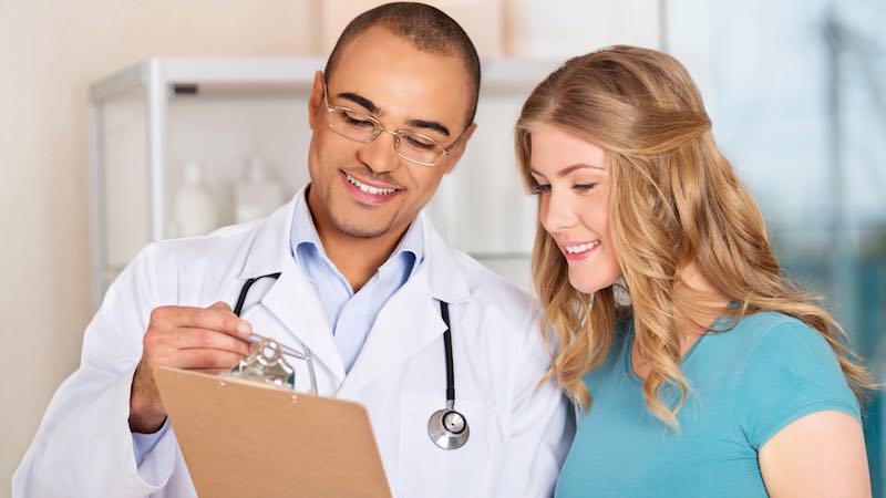 A doctor explaining care options to a female patient.