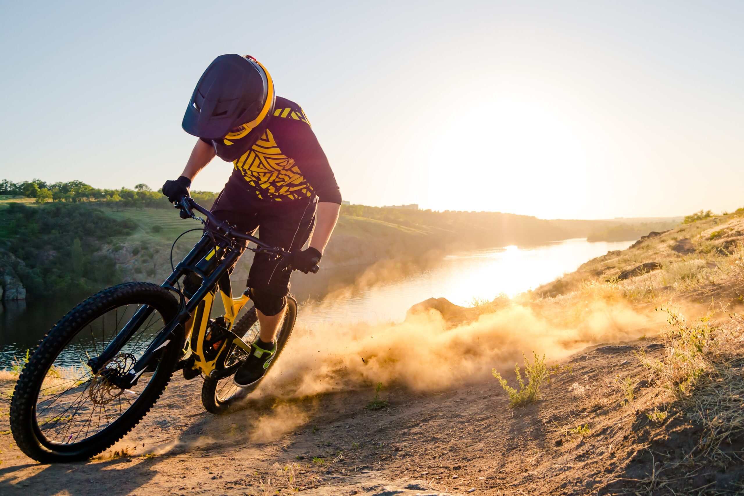 cyclist carves the trail, evening, enduro mountain biking discipline