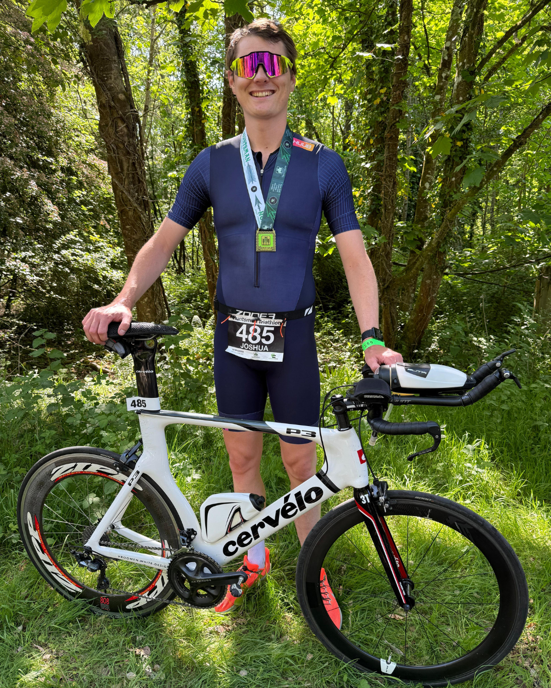 a cyclist wearing a medal