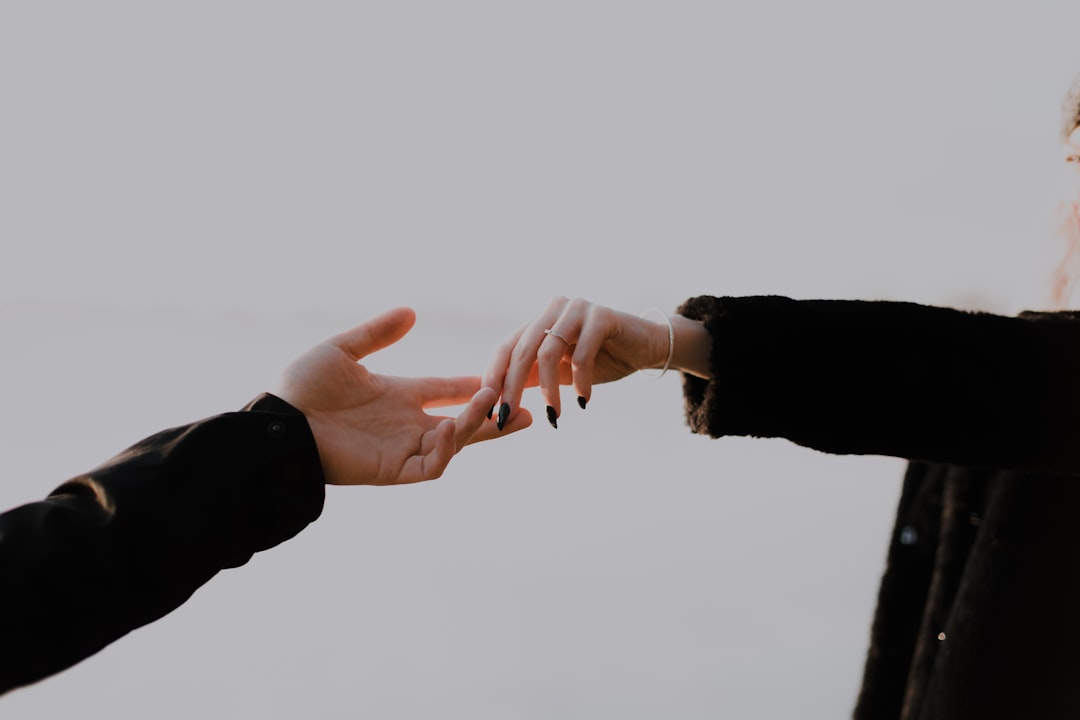 Two people shaking hands in a Florida office, representing talent recruitment and retention.